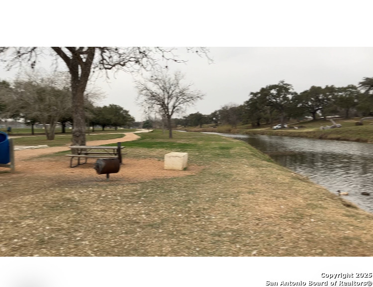 406 Patrick Avenue Pleasanton, TX 78064 - Photo 14 of 18 a view of a lake with houses in the back