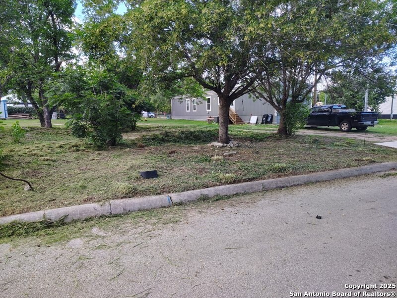 406 Patrick Avenue Pleasanton, TX 78064 - Photo 2 of 18 a front view of a house with a yard