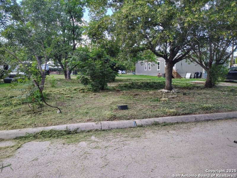 406 Patrick Avenue Pleasanton, TX 78064 - Photo 3 of 18 a view of a house with a tree in the background