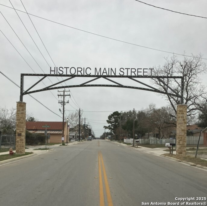 406 Patrick Avenue Pleasanton, TX 78064 - Photo 5 of 18 a view of a street with a road sign