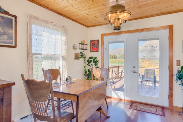 3476 F Road Clifton, CO 81520 - Photo 12 of 29 a view of a dining room with furniture wooden floor and chandelier
