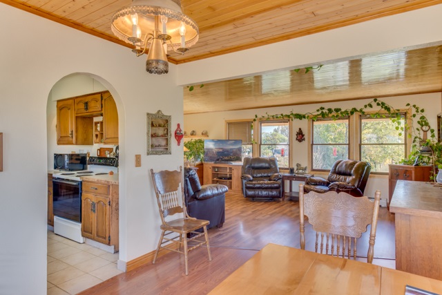 3476 F Road Clifton, CO 81520 - Photo 13 of 29 a living room with fireplace furniture and a chandelier
