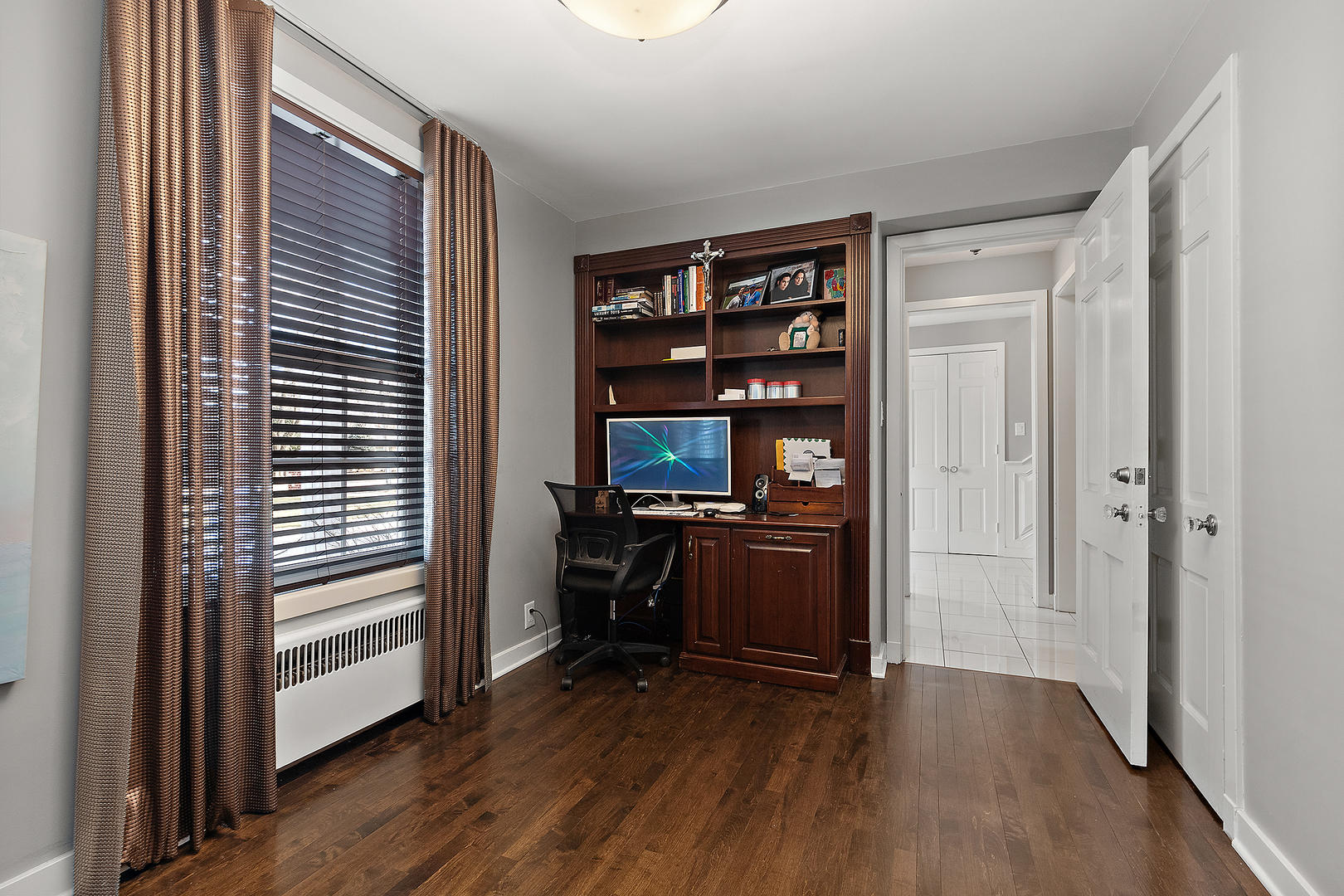 305 North Reed Street Joliet, IL 60435 - Photo 27 of 62 a view of a workspace with furniture and wooden floor