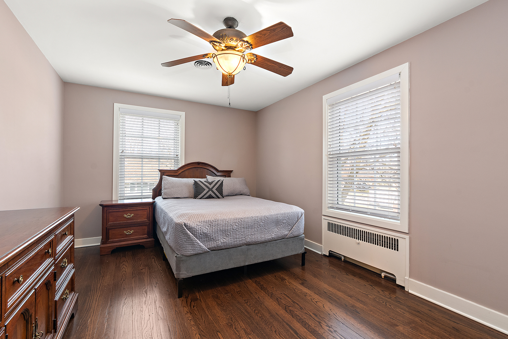 305 North Reed Street Joliet, IL 60435 - Photo 36 of 62 a bedroom with a bed and a chandelier
