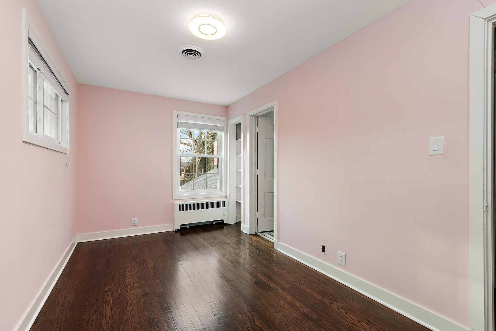 305 North Reed Street Joliet, IL 60435 - Photo 39 of 62 an empty room with wooden floor and windows