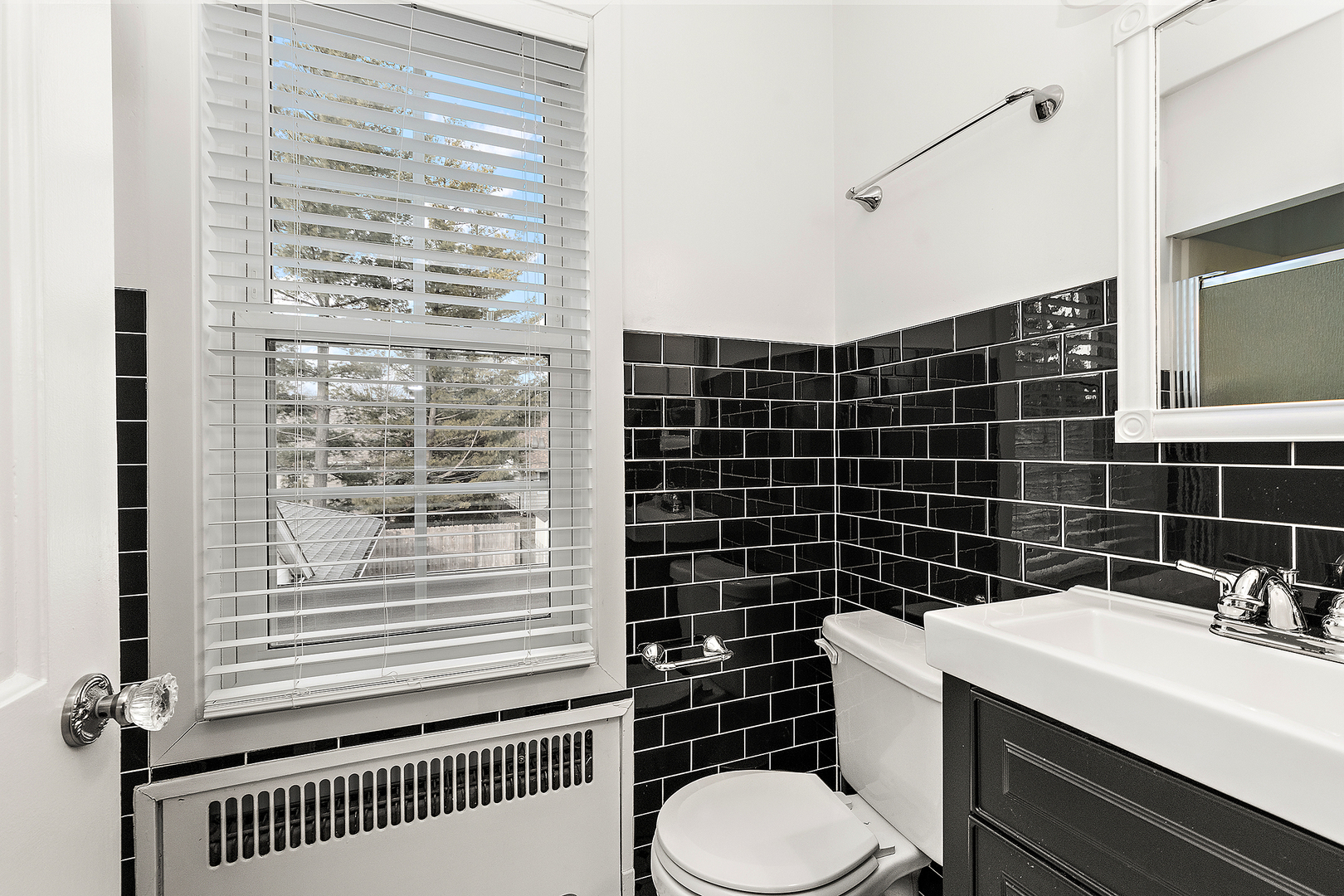 305 North Reed Street Joliet, IL 60435 - Photo 40 of 62 a bathroom with a sink toilet and shower