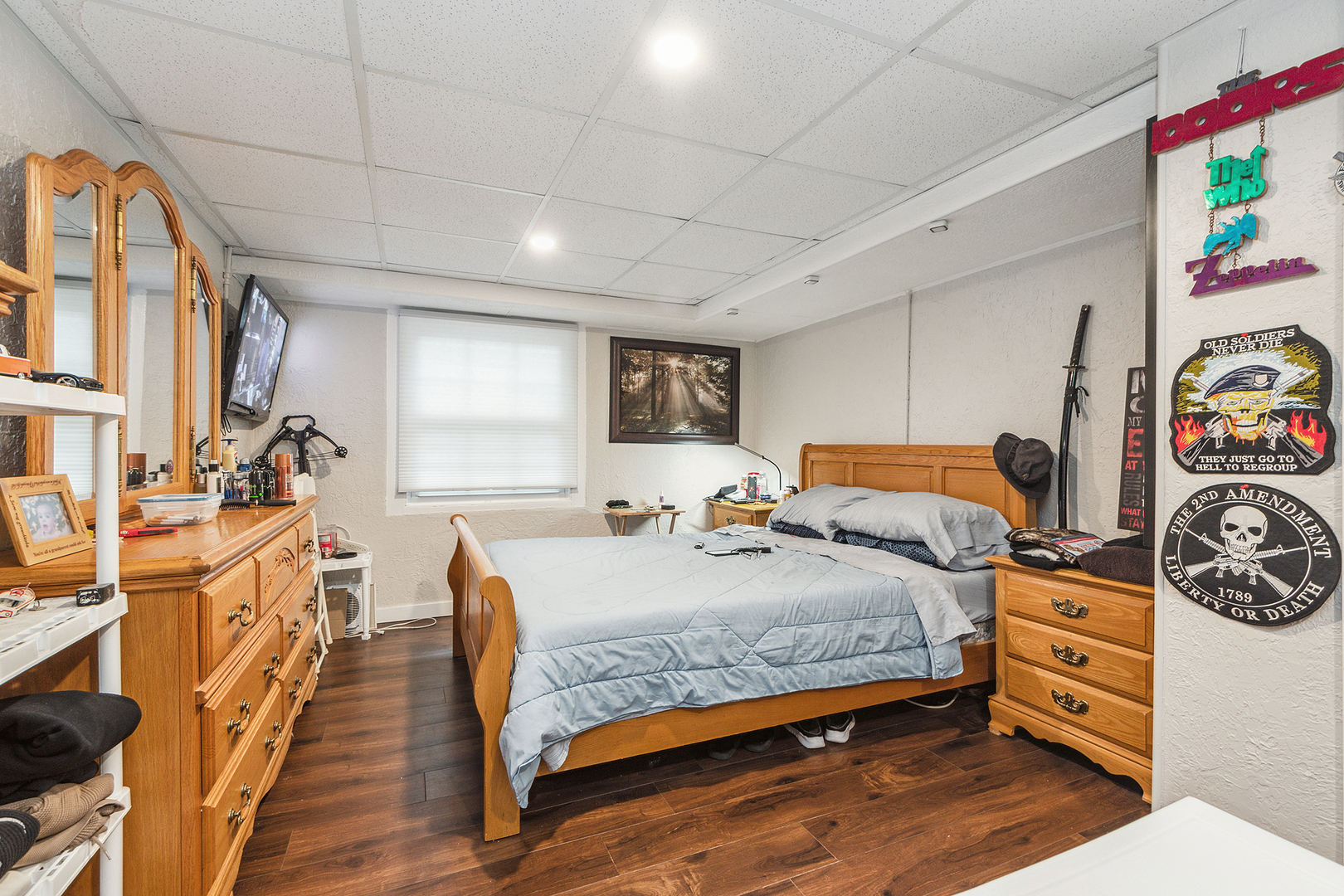305 North Reed Street Joliet, IL 60435 - Photo 44 of 62 a bedroom with a bed and wooden floor