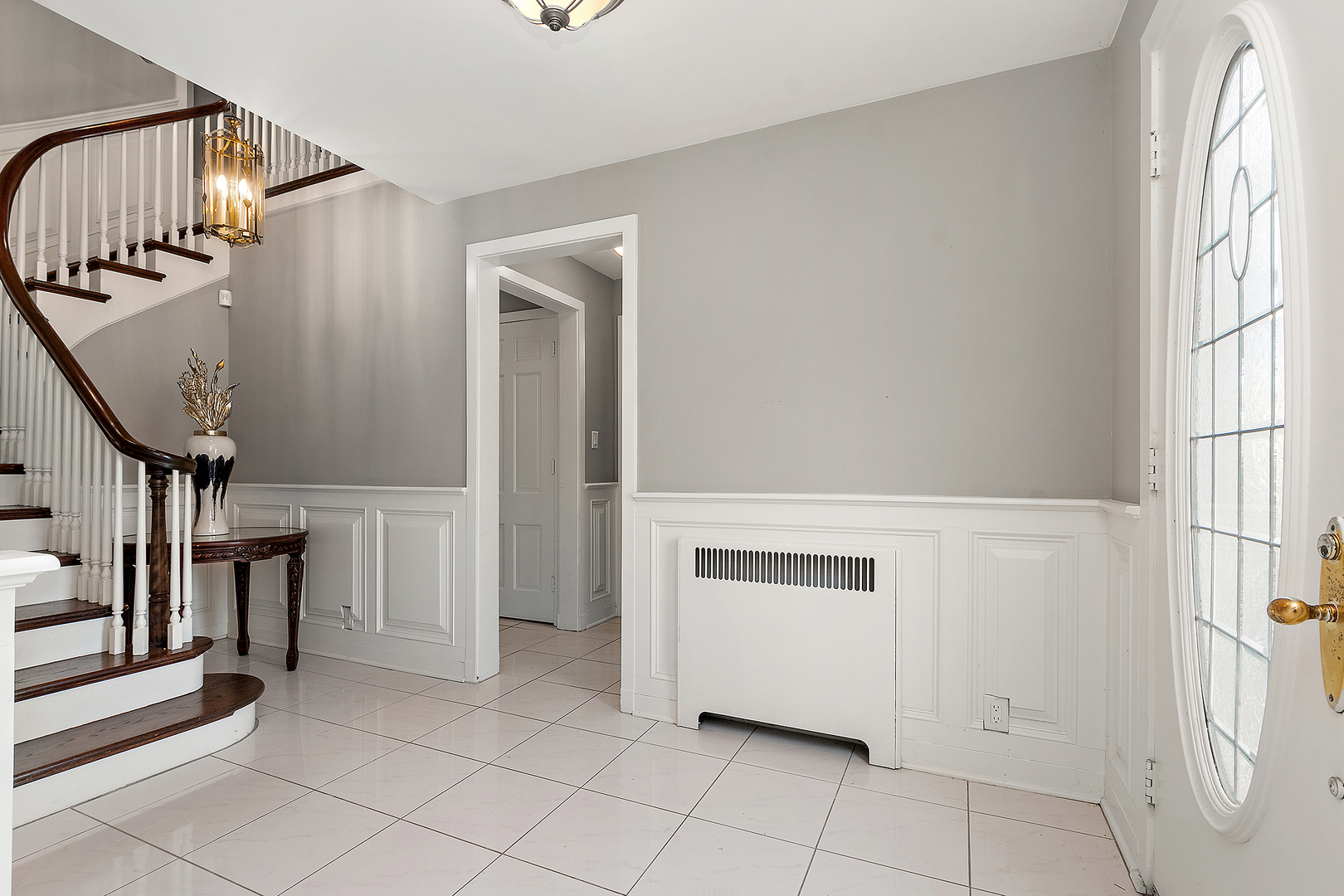 305 North Reed Street Joliet, IL 60435 - Photo 6 of 62 a view of front door with entryway and stairs