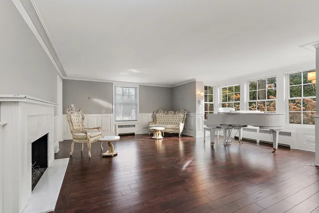 a living room with furniture window and wooden floor