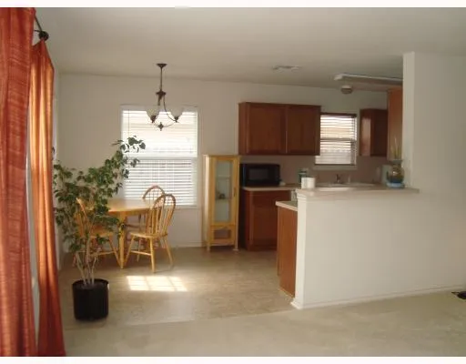 a kitchen with granite countertop sink cabinets and stainless steel appliances