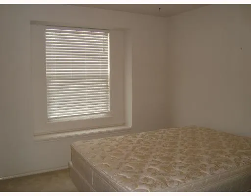 a view of an empty room and a window