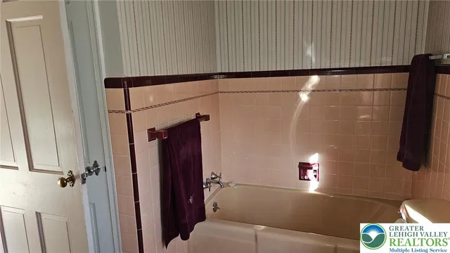 a bathroom with a shower and a sink