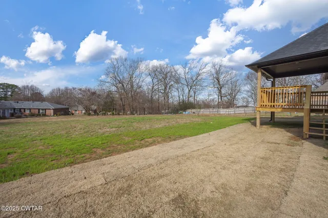 a view of a house with a big yard