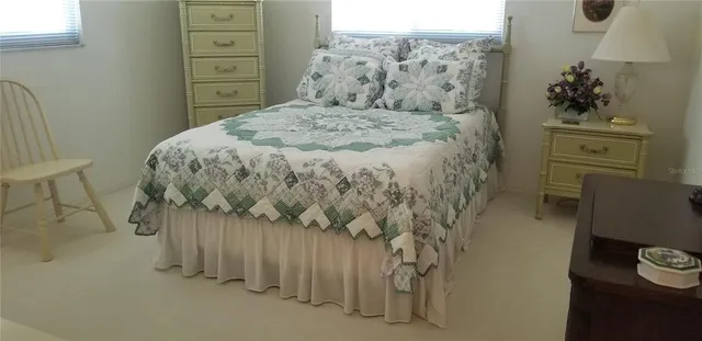 a bedroom with a bed and a dresser