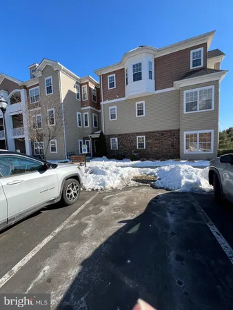 a view of a street that has couple of cars parked on the road