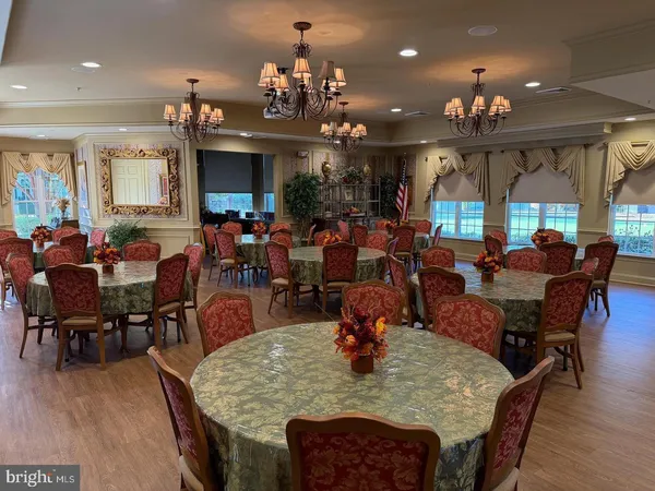 a view of a dining area with furniture window and wooden floor