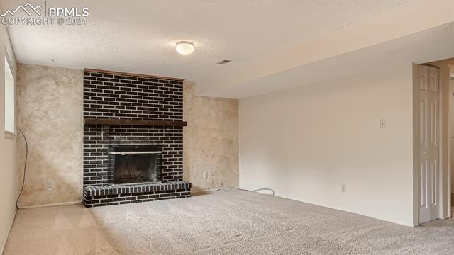 2515 Ranch Lane Colorado Springs, CO 80918 - Photo 20 of 25 Fireplace in Family Room