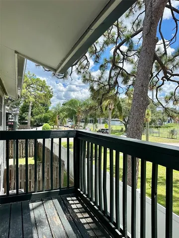a view of balcony with wooden floor