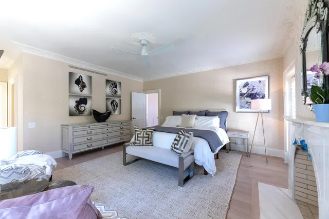 a spacious bathroom with a toilet sink and mirror
