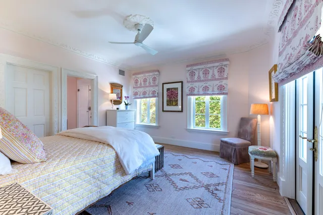 a bedroom with furniture and a window