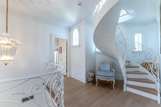 a bedroom with a bed couch and a window