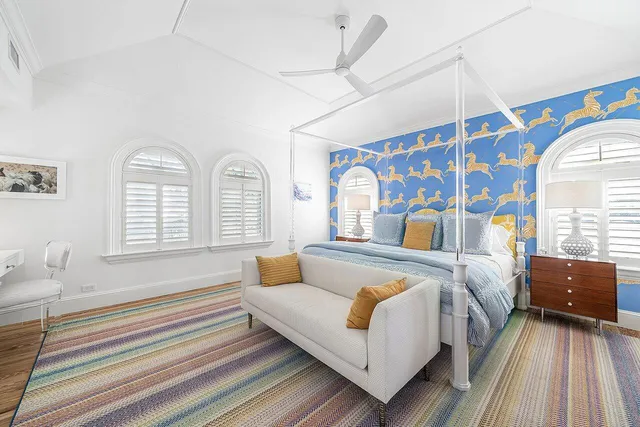 a bathroom with a granite countertop sink a mirror and a shower