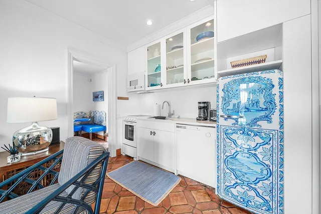 a view of entryway with furniture and wooden floor