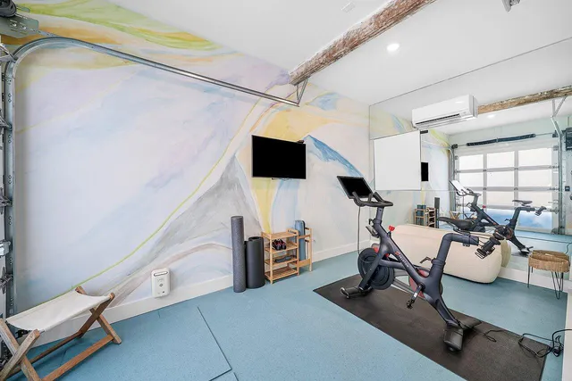 a front view of house with yard and outdoor seating