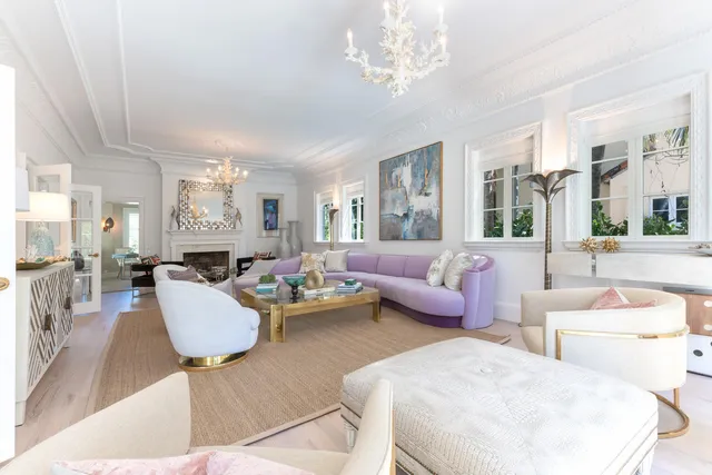 a living room with furniture or chandelier and a dining table
