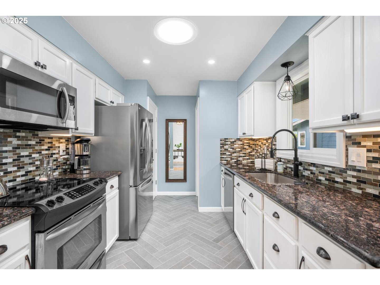 2000 Northwest 7th Place Gresham, OR 97030 - Photo 11 of 34 a kitchen with granite countertop a sink stainless steel appliances and cabinets