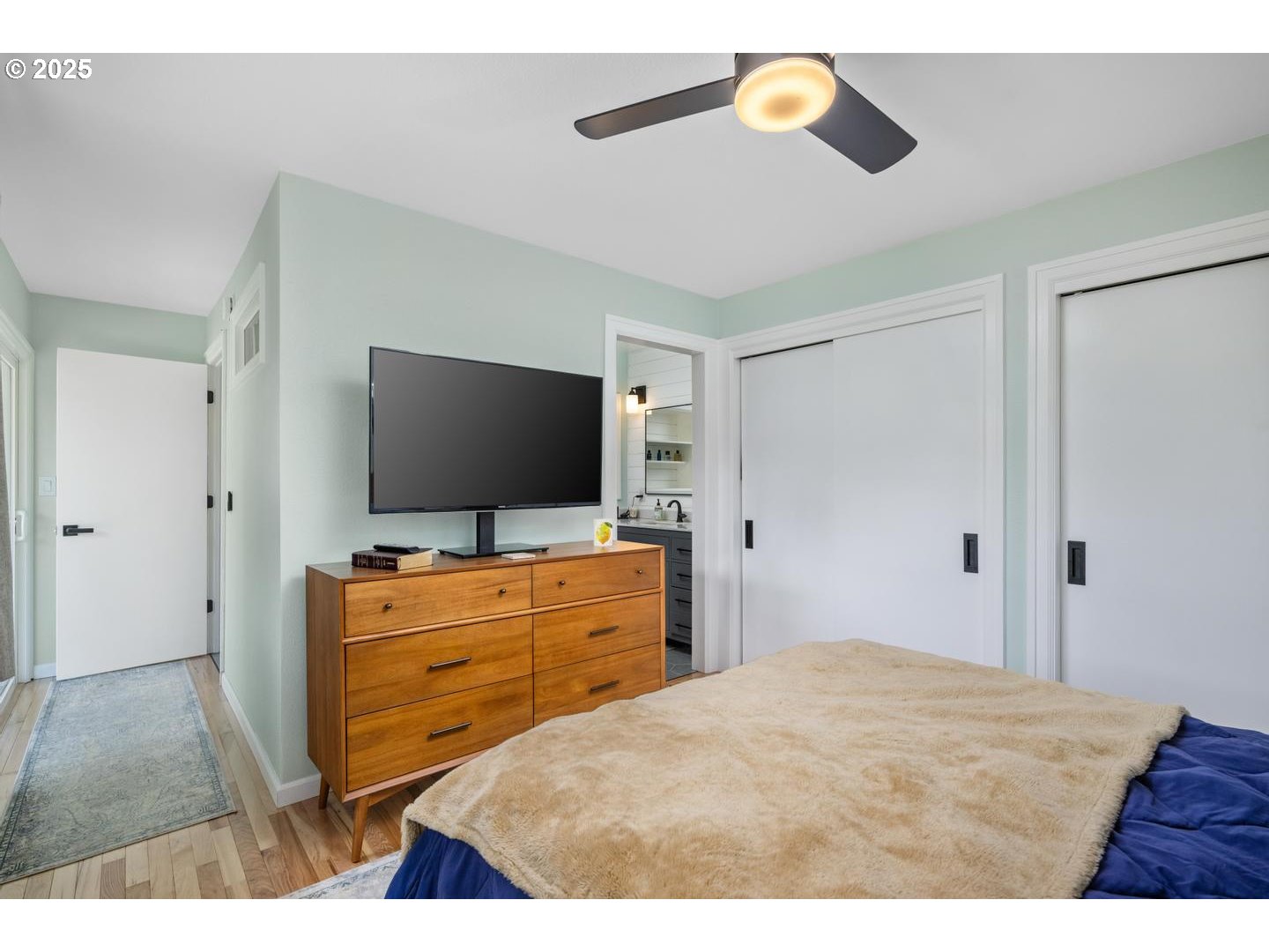 2000 Northwest 7th Place Gresham, OR 97030 - Photo 12 of 34 a bedroom with a bed and a flat screen tv