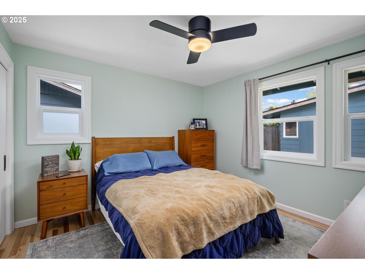 2000 Northwest 7th Place Gresham, OR 97030 - Photo 13 of 34 a bedroom with a bed and a chandelier