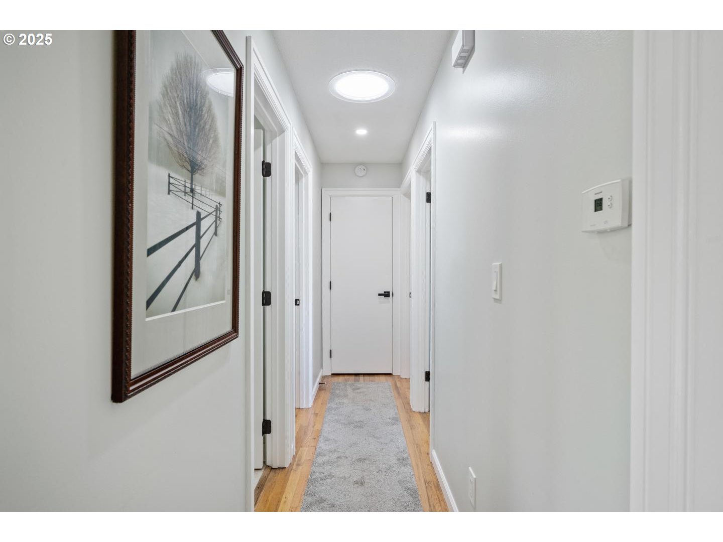 2000 Northwest 7th Place Gresham, OR 97030 - Photo 16 of 34 a view of a hallway with wooden floor