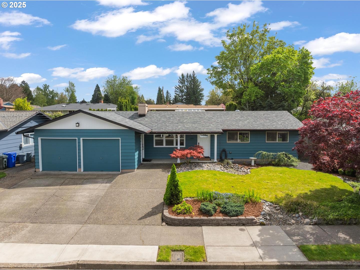 2000 Northwest 7th Place Gresham, OR 97030 - Photo 2 of 34 a front view of a house with a yard and potted plants