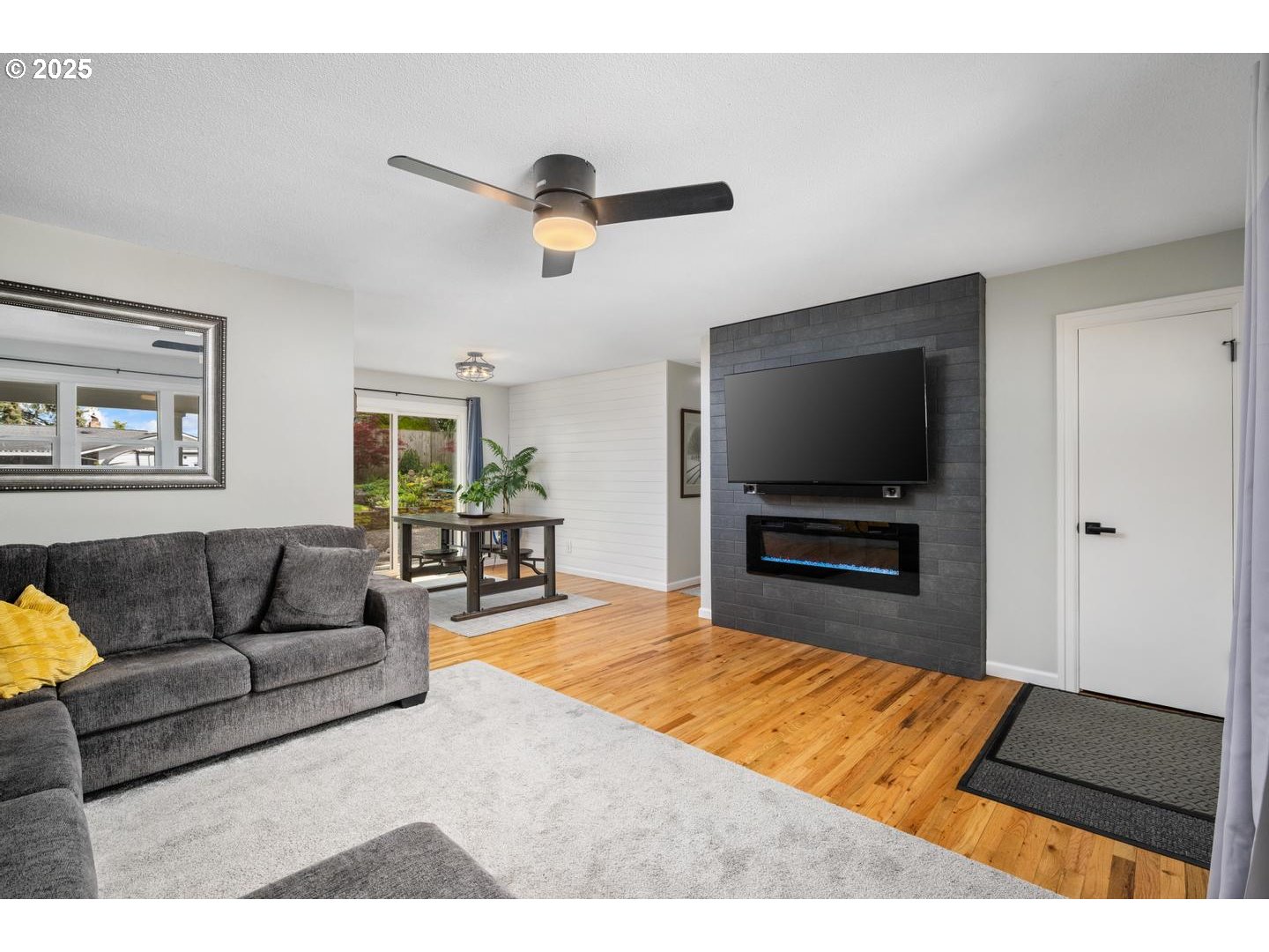 2000 Northwest 7th Place Gresham, OR 97030 - Photo 5 of 34 a living room with furniture and a flat screen tv