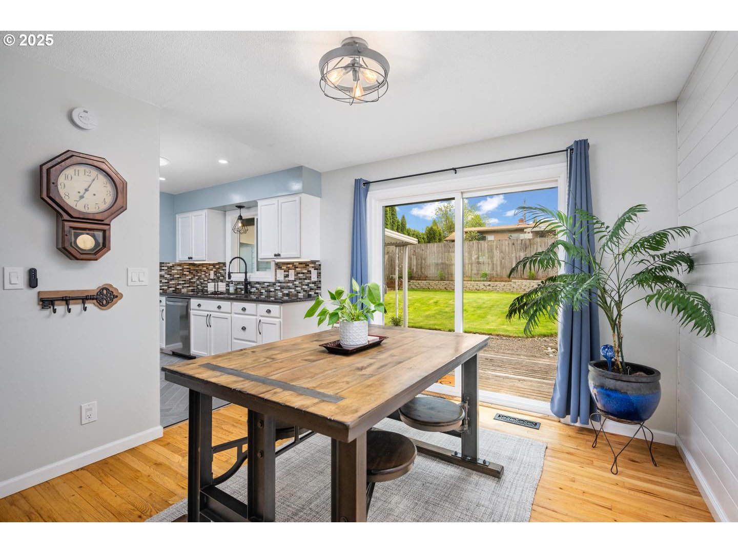 2000 Northwest 7th Place Gresham, OR 97030 - Photo 7 of 34 a view of a dining room with furniture and a potted plant