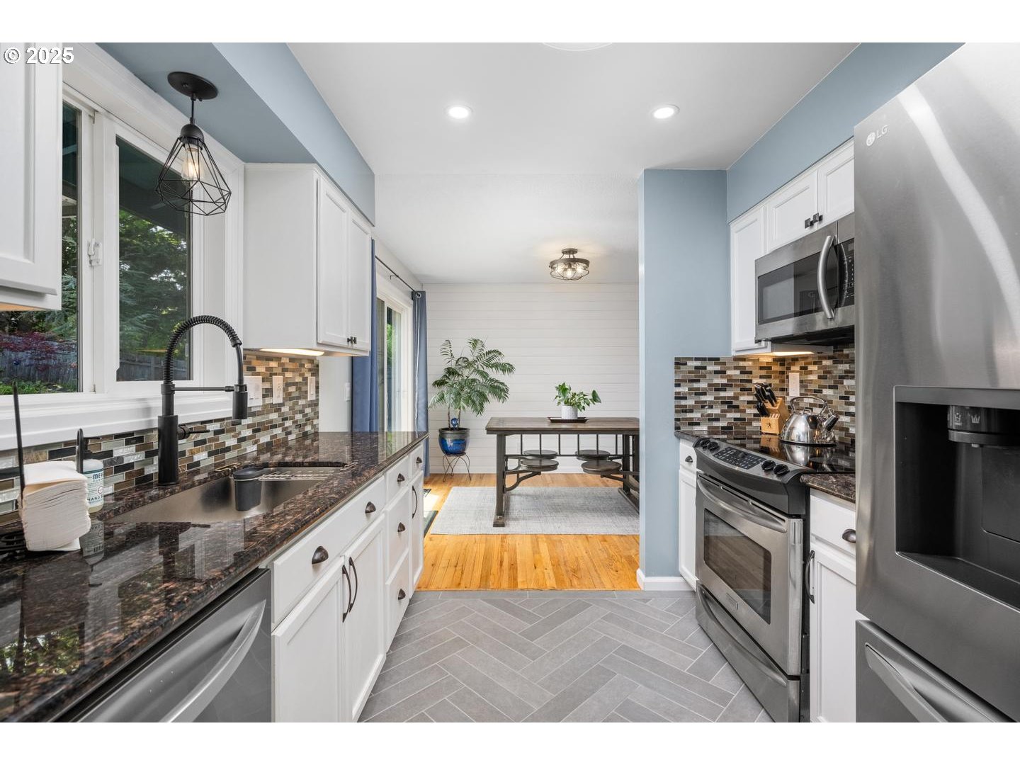 2000 Northwest 7th Place Gresham, OR 97030 - Photo 8 of 34 a kitchen with stainless steel appliances granite countertop a sink stove and refrigerator