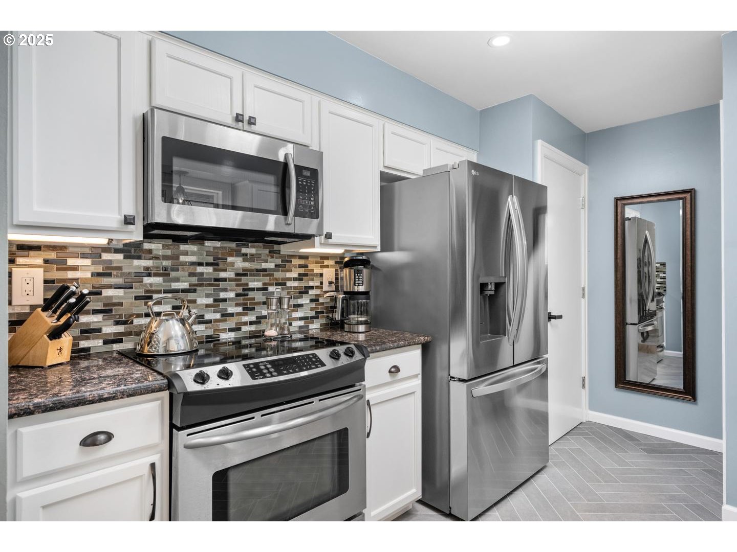 2000 Northwest 7th Place Gresham, OR 97030 - Photo 9 of 34 a kitchen with stainless steel appliances granite countertop a refrigerator stove and microwave