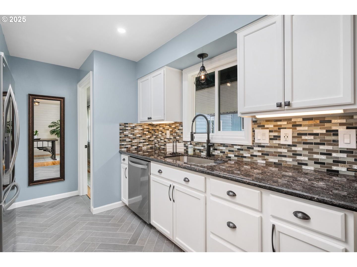 2000 Northwest 7th Place Gresham, OR 97030 - Photo 10 of 34 a kitchen with granite countertop a sink a stove and cabinets