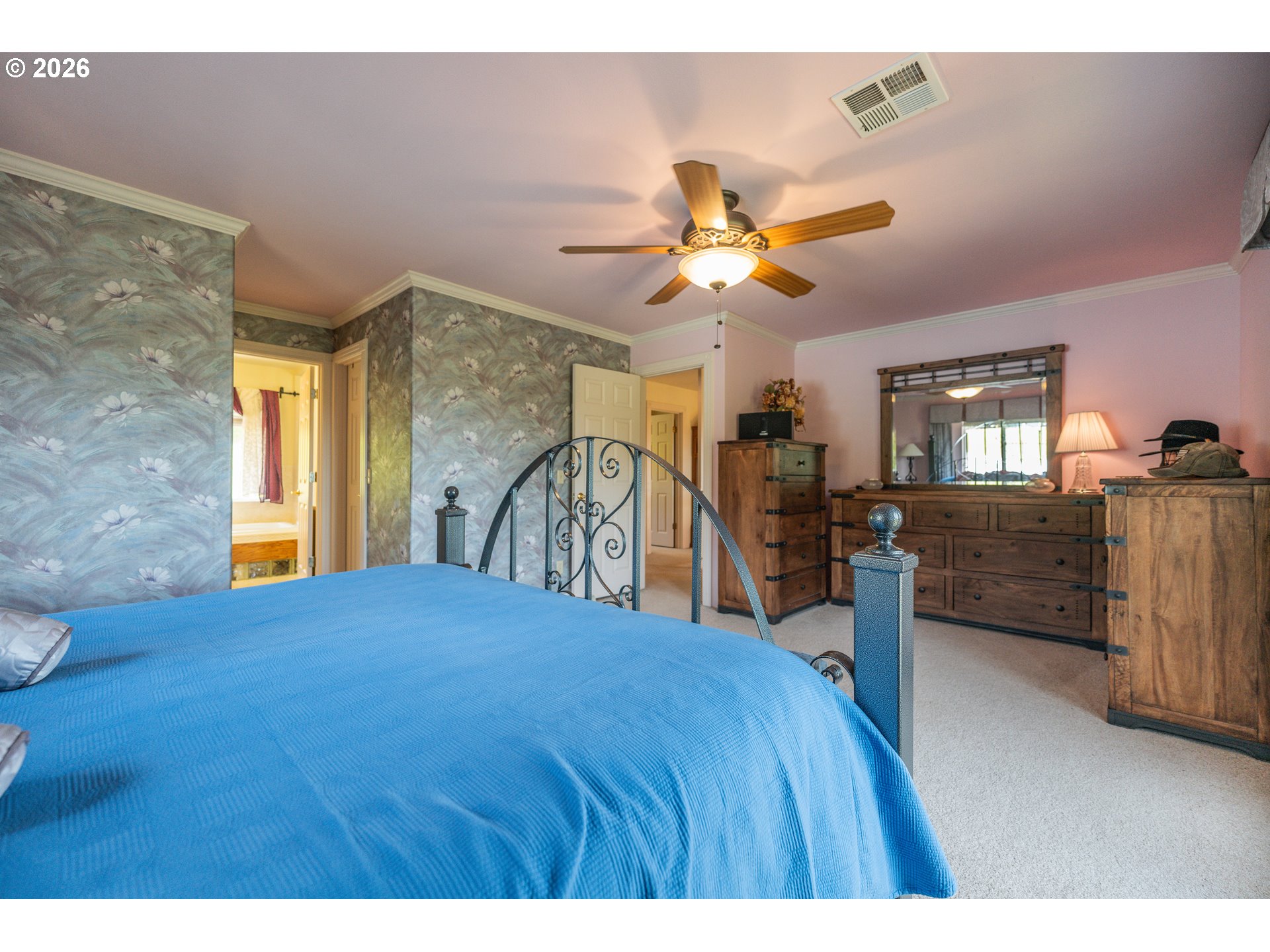 489 Fir Vista Road Sutherlin, OR 97479 - Photo 19 of 47 a bedroom with a bed and a chandelier