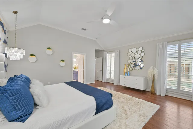 a spacious bedroom with a large bed and a window