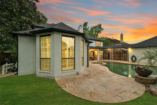 front view of a house with a garden