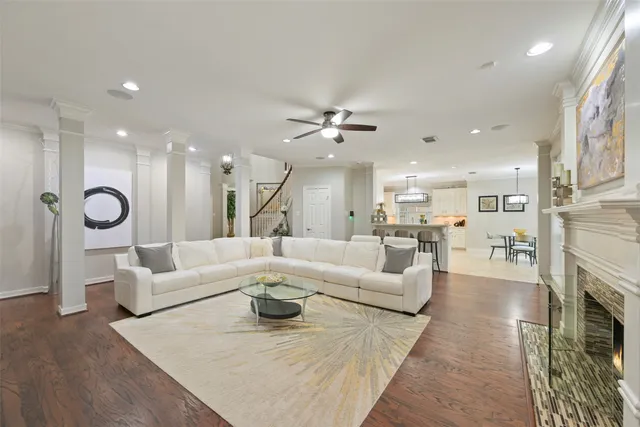 a living room with furniture fireplace and a view of kitchen