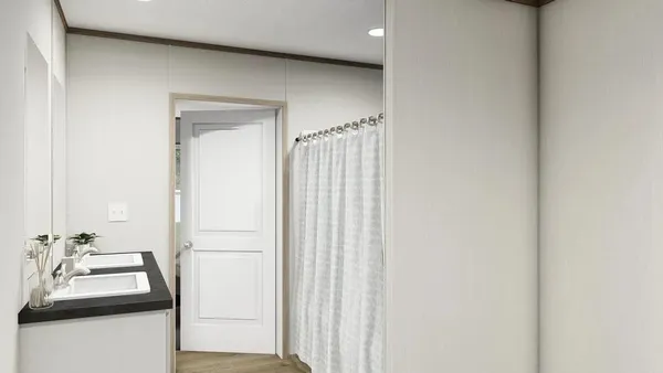 a bathroom with a sink a mirror and a shower