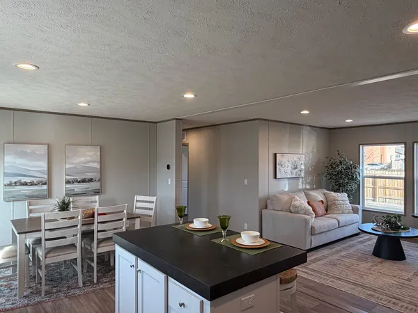a living room with furniture and a table
