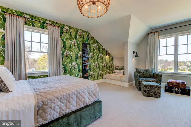 a bedroom with a bed and a couch