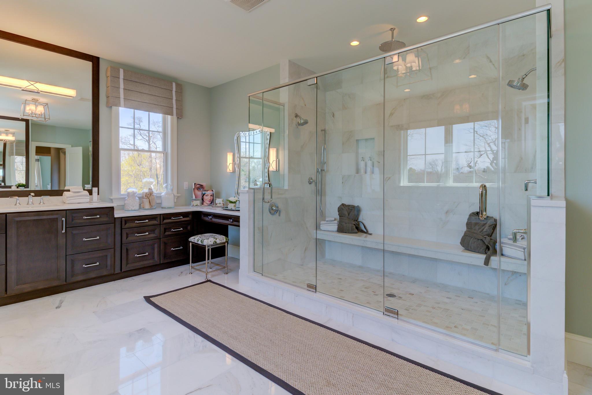 39 Old Covered Bridge Road Newtown Square, PA 19073 - Photo 16 of 19 a bathroom with a tub a sink a mirror and a shower