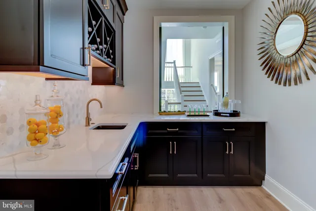 a kitchen with a sink and a stove