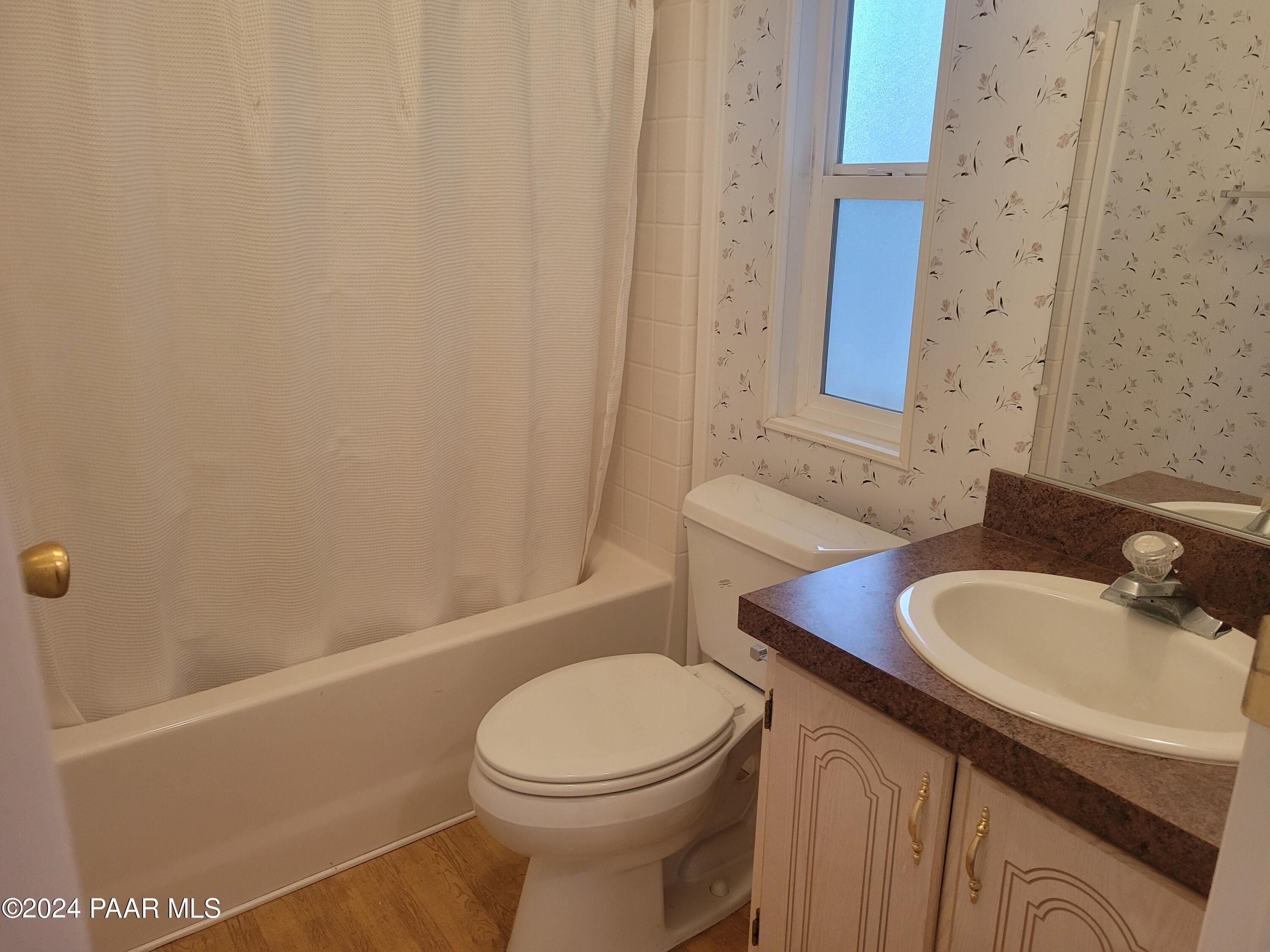 99 Alpine Prescott, AZ 86305 - Photo 17 of 25 a bathroom with a sink a toilet and shower