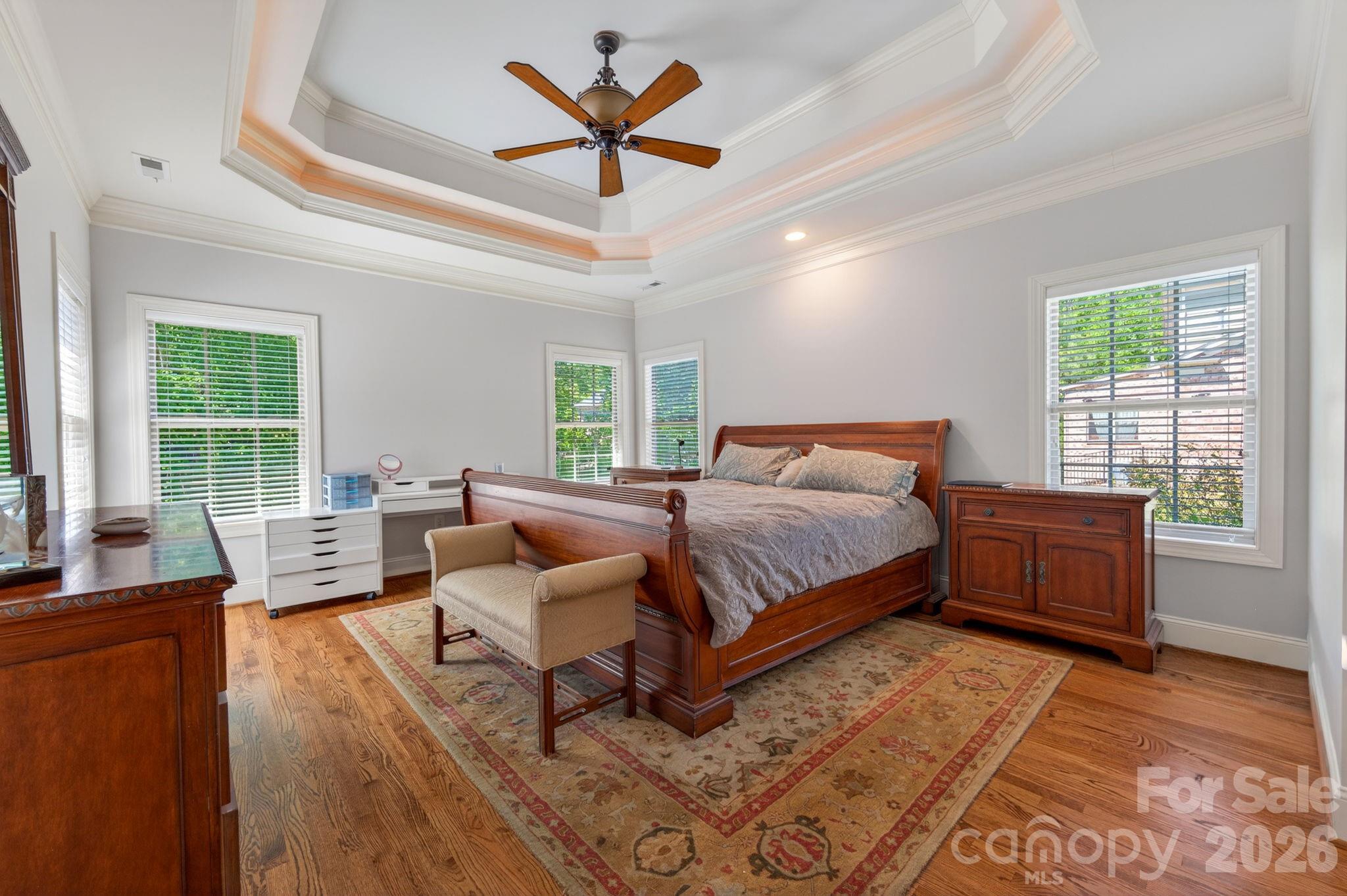 3138 Rappahannock Court, Unit 16 Matthews, NC 28104 - Photo 36 of 38 a bedroom with a large bed and a couch